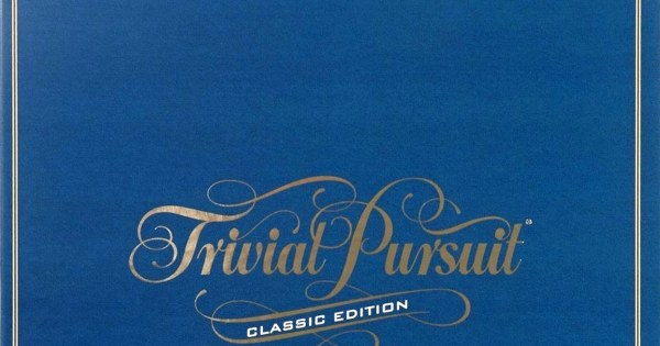 Trivial Pursuit game pieces and colorful question cards