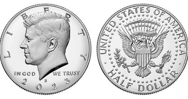 Large silver half dollar coin in velvet display case.
